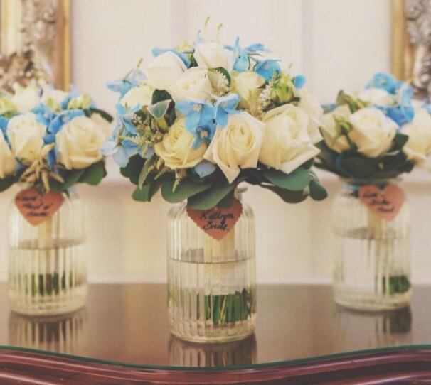 Beautiful arrangement of table flowers in white and blue